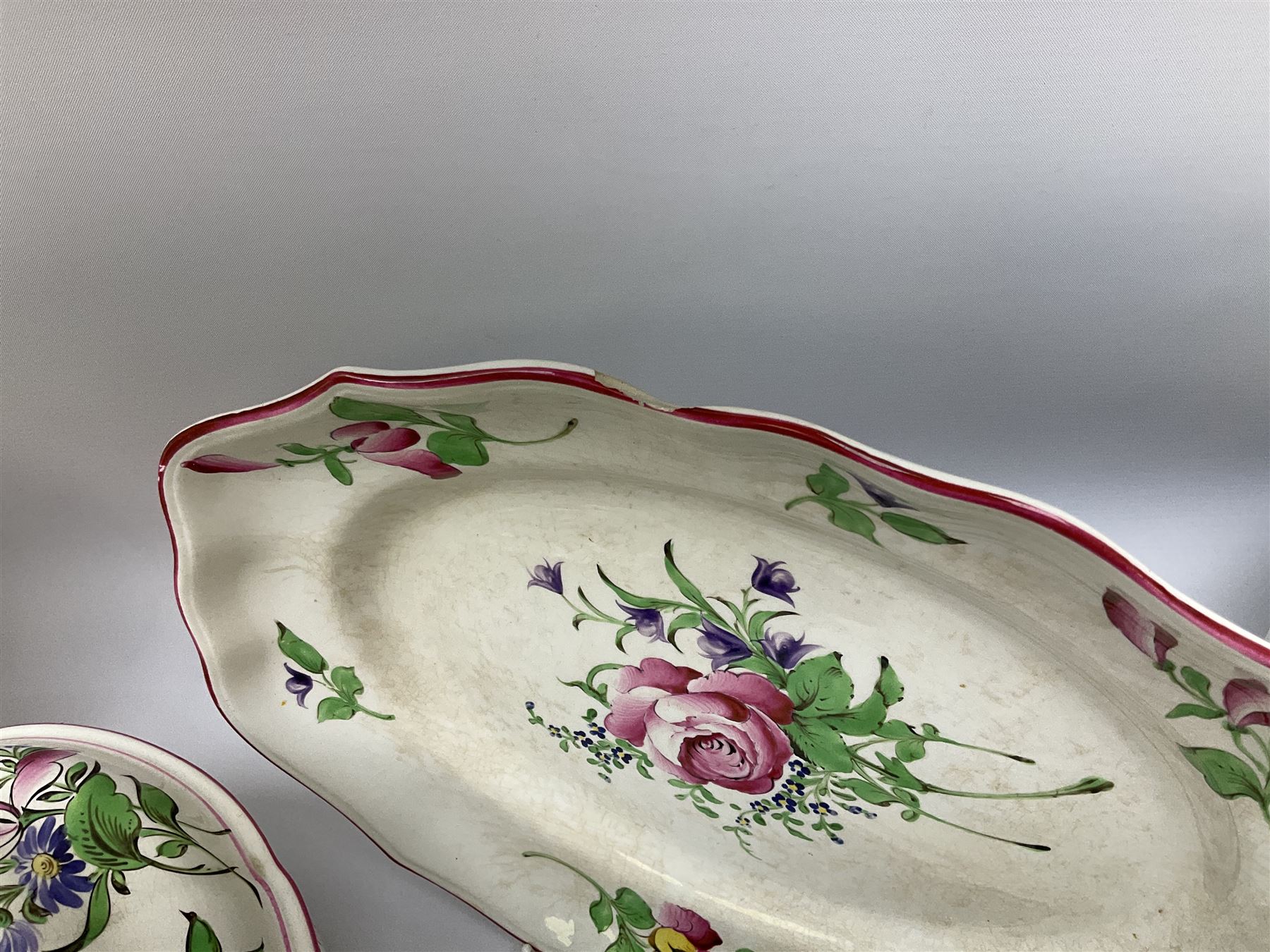 Matched Copeland Spode, Spode and French Luneville and Marlborough Sprays pattern dinner and tea wares, comprising two tureen and covers and apple finials, two sauce tureen and covers with pear finials and fixed stands, six graduated platters including two pairs, large plate, thirteen dinner plates, twelve bowls, ten smaller bowls, eight side plates, eleven smaller side plates, teapot, twin handled sucrier and cover with apple finial, open sucrier, cream jug, smaller cream jug, four breakfast cups, eight tea cups, four large saucers, eleven smaller saucers, and nine further smaller saucers. 