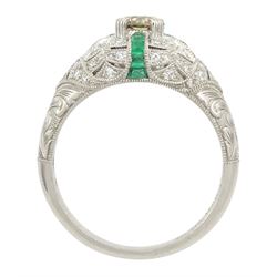 Platinum emerald and diamond ring, the principal transitional cut diamond of 0.41 carat, with milgrain set calibre cut emeralds and single cut diamonds surround and engraved foliate decoration shoulders, stamped Plat