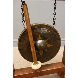  'Mouseman' pegged oak gong stand, painted circular gong, stepped sledge supports, by Robert Thompson of Kilburn W39cm H61cm D21cm  Provenance - Commission by the vendor's parents in the 1950s  