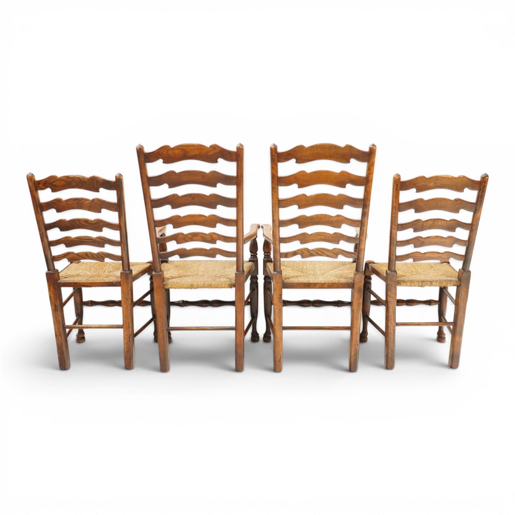 Set of eight country ladderback chairs (6+2), shaped ladderback over a rush seat, raised on turned supports, united by stretchers