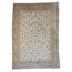 Persian Kashan carpet, ivory field filled with intricate scrolling foliage and stylised fl...