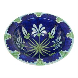 After Torquato Castellani, tin-glazed earthenware bowl, with a floral design the the centr...