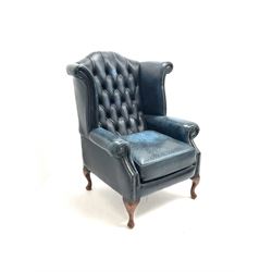 Queen Anne style wing back deep button armchair, upholstered in deep blue leather
