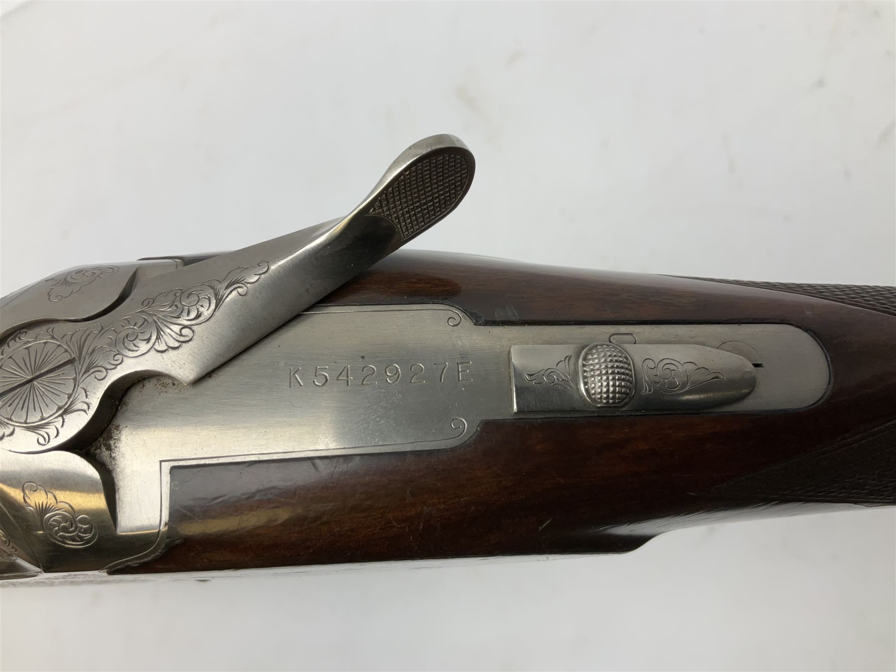 Winchester Japan 5500 12-bore by two-and-three quarters over-and-under double barrel boxlock ejector sporting gun, with 71cm barrels, ventilated rib and barrels, the walnut stock with chequered pistol grip and fore-end, single selective trigger and top safety, serial no.K542927E, L115cm overall; in gun sling SHOTGUN CERTIFICATE REQUIRED