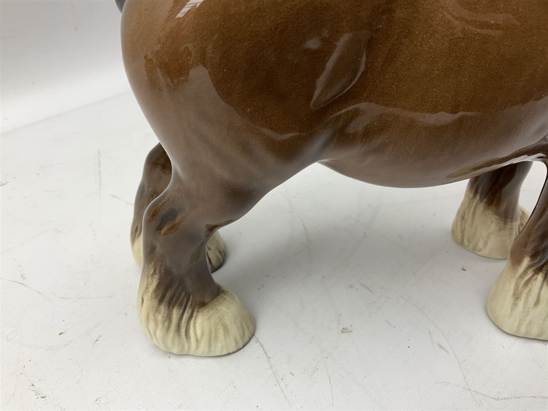 Three Beswick models comprising Hereford Bull no 949, 'CH Cutmil Cupie' Pug, and bay Shire horse, all with printed marks beneath