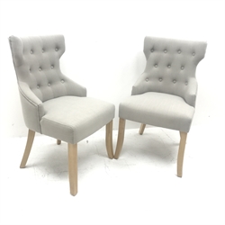 Pair side chairs upholstered in buttoned light blue fabric, shaped supports, W54cm