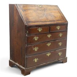 18th century inlaid oak bureau, the fall-front with central star inlay enclosing fitted interior with central cupboard flanked by fluted column correspondence drawers and pigeon holes, over two short and three long drawers, lower moulded edge on bracket feet