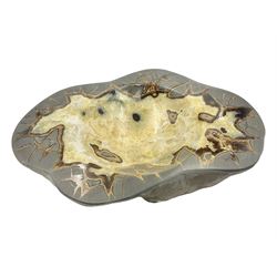 Septarian dish, with a calcite centre and argonite/siderite lines within limestone rock and rough outer edges, H6cm, L25cm