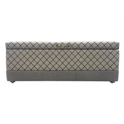 Oka - contemporary mango wood upholstered ottoman, rectangular frame with a printed cotton dhurrie featuring a diamond pattern and wavy stripe border, fitted with brass hinges, decorative studs, and handle