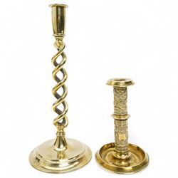 Early 20th century brass 'Mr Punch' doorstop H29cm, another 'Judy' H28cm, pair of brass Jack of Diamonds brass candlesticks H36cm, two other candlesticks and a chamber stick (7)