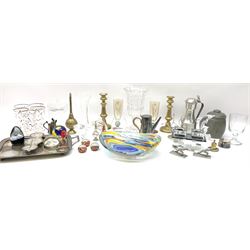 Quantity of metal ware to include a silver plated twin handled tray and a pair of brass candlesticks, and a quantity of glassware to include a Waterford dolphin figure, art glass bowl, drinking glasses, vases, paperweights etc  