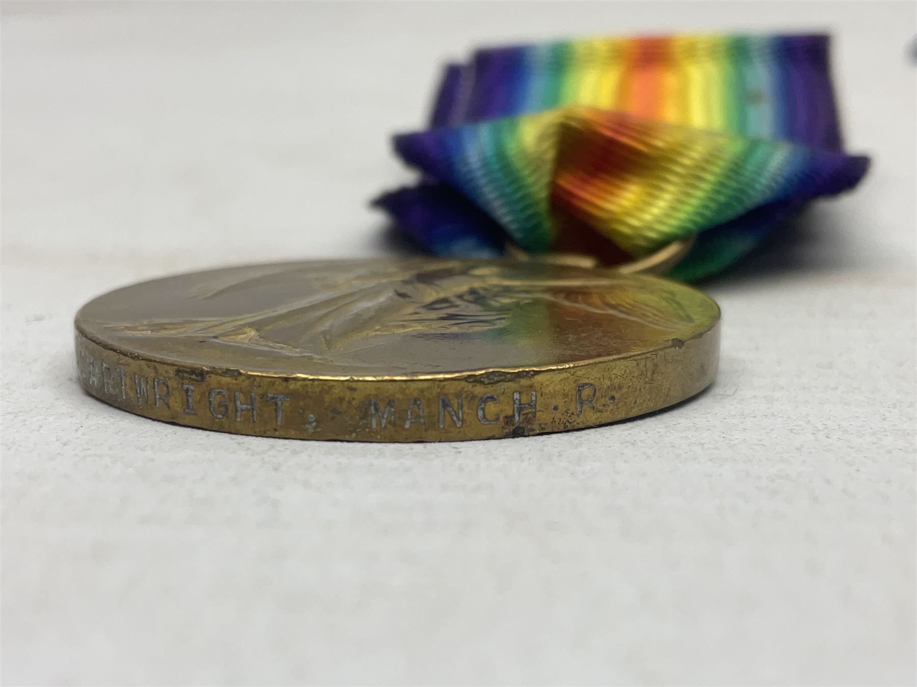 WW1 group of three medals comprising British War Medal, 1914-15 Star and Victory Medal awarded to 1781 Pte. W. Cartwright Manch. R.; and another WW1 British War Medal awarded to 30284 Pte. W.H. Paterson Manch. R.; all with ribbons (4)