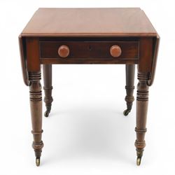 Mahogany drop-leaf Pembroke table circa 1900, with rounded rectangular top and single frieze drawer, raised on turned and tapered supports with brass castors (Extended 128cm)
