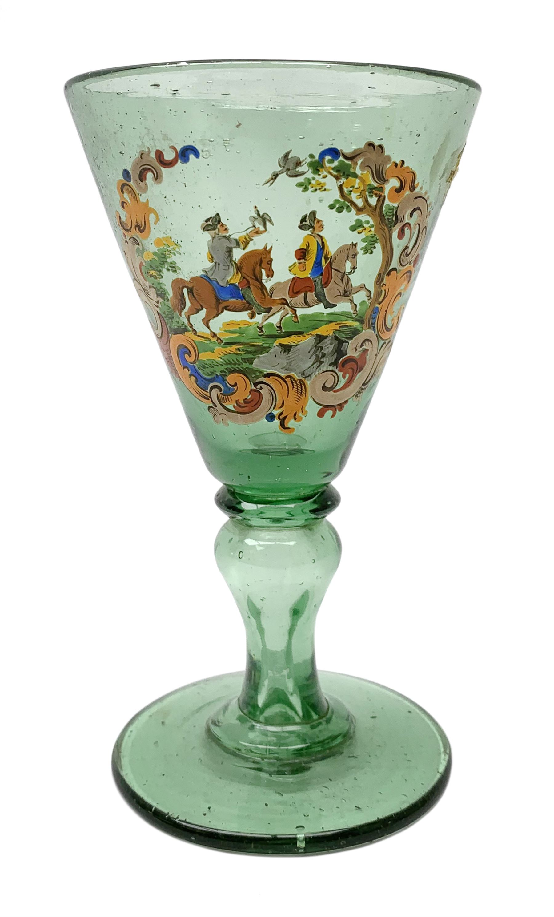 19th century bohemian green glass wine glass, the funnel bowl decorated in enamells with a Historismus hunting scene in the manner of Egermann & Lobmeyr, upon a baluster stem and circular foot, H14.5cm