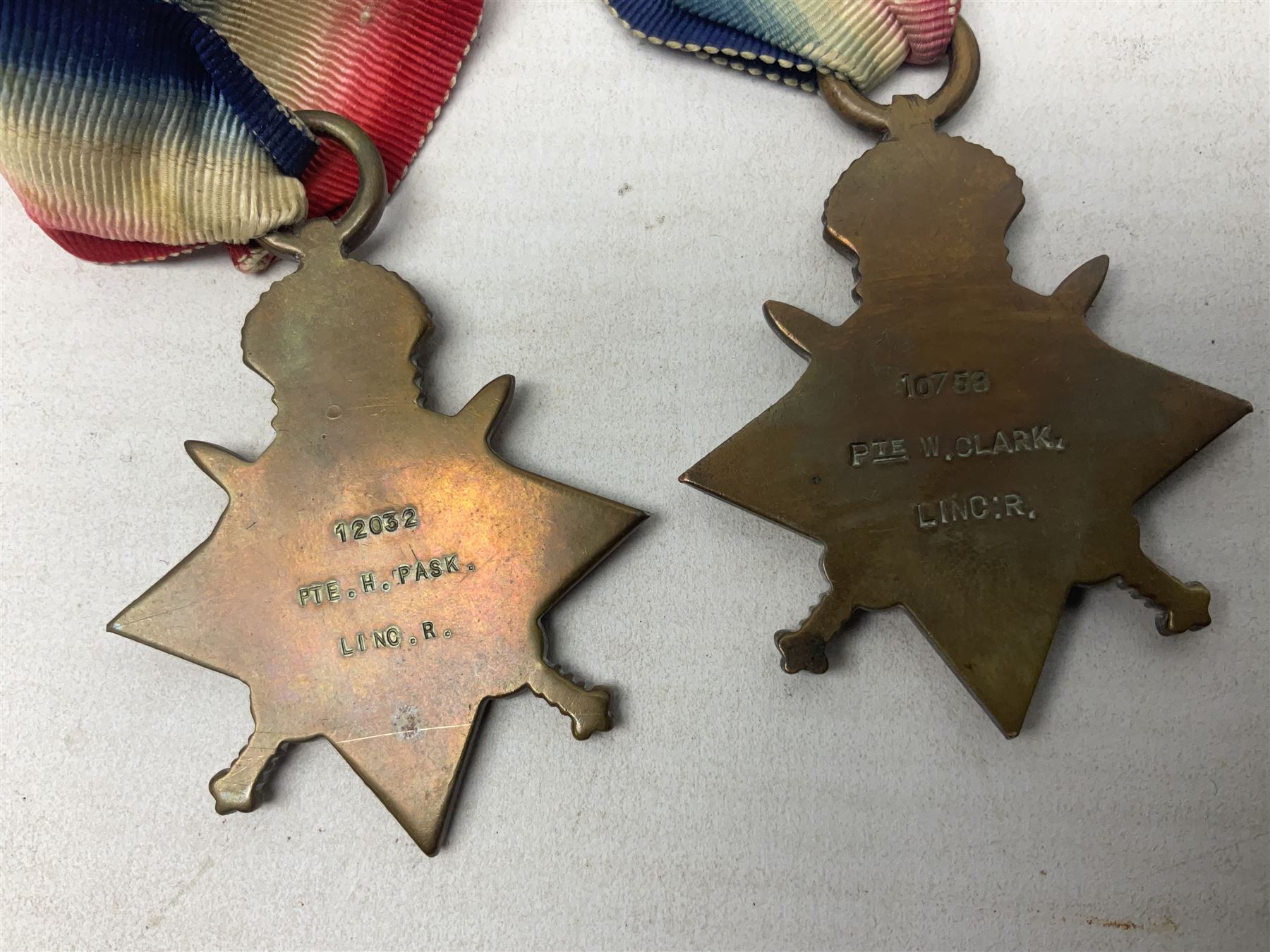 Five WW1 Lincolnshire Regiment medals comprising 1914-15 Star awarded to 12032 Pte. H. Pask; 1914-15 Star to 10759 Pte. W. Clark; British War Medal to 7739 A. Sjt. G.W.L. Atkin; Victory Medal to 22678 Cpl. H. Vallance; all with ribbons; and Victory Medal to 6014 Pte. W.S. Boulton; some biographical details (5)