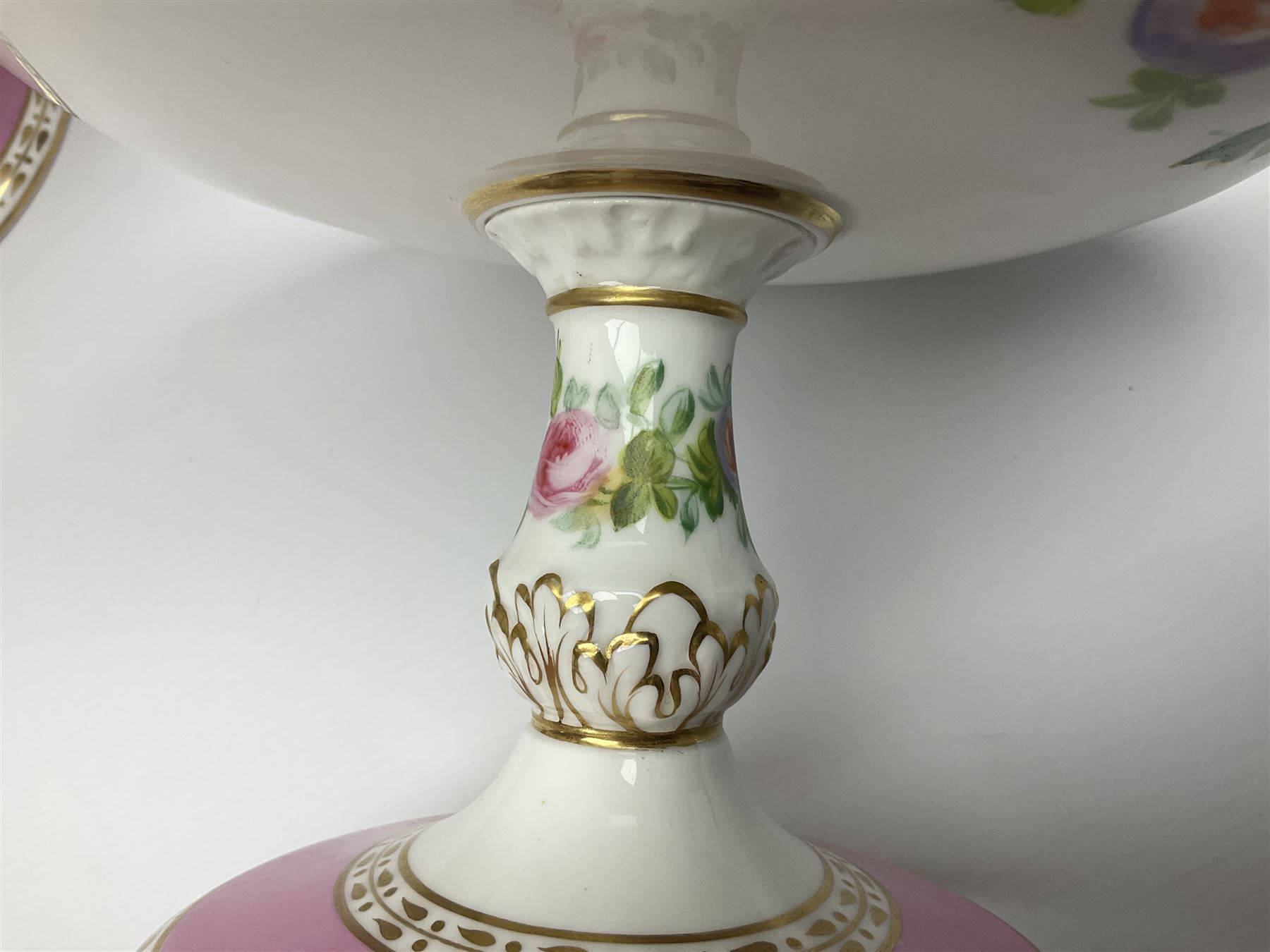 Victorian Copeland, Botanical dessert service, decorated with floral sprigs to the centre with a pink and gilt border, comprising five comports and seven plates, largest comport H20cm, plate D22cm