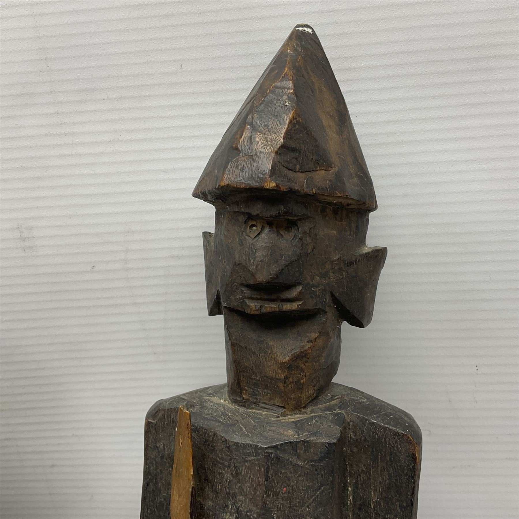 Bronzed bust of Greek man upon a marble base, together with two wooden sculptures 