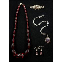 Silver Blue John pendant, hallmarked and a Blue John brooch and an cherry amber style bead necklace with matching earrings