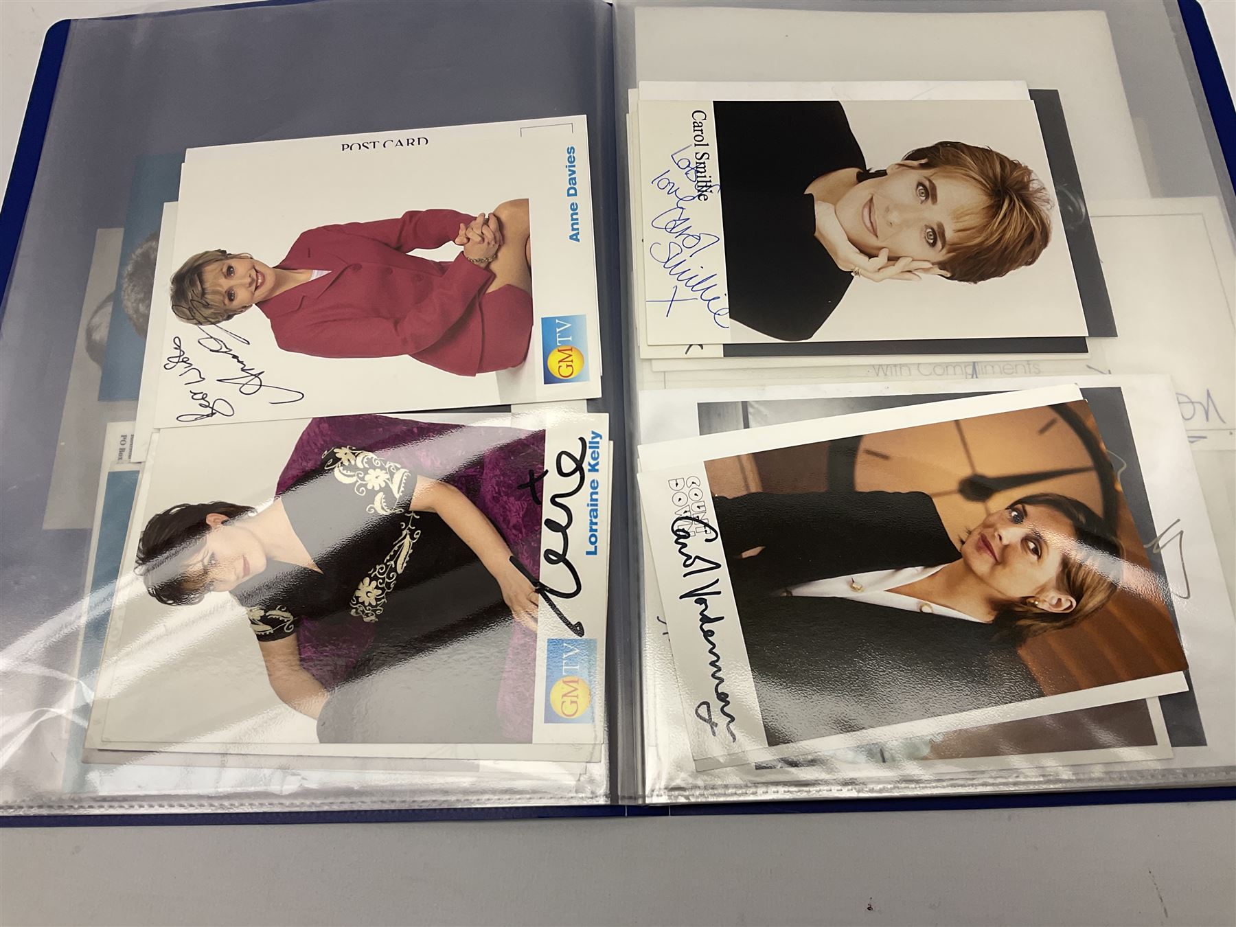 Two folders of over fifty photographs, cards, compliment slips etc of actors, actresses, celebrities, politicians, sports personalities etc, all bearing signatures, including David Frost, Lloyd Grosman, John Suchet, Julia Somerville and othe GMTV presenters, Carol Vorderman, Jackie Collins, Rolf Harris, Timothy Dalton, Pete Postlethwaite, Magnus magnusson, John Major, Kate Moss, Uri Geller, David Beckham, Peter Alliss, Sharon Davies, Kevin Keegan etc