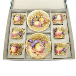 Aynsley fruit pattern, set of six coffee cans and saucers, gilded and decorated with fruit signed by N Brunt, in the original box, can H6cm