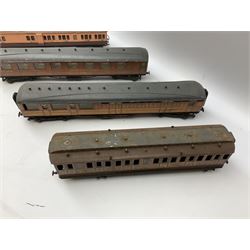 '0' gauge - four early 20th century scratch-built wooden and metal large teak effect passenger coaches with LNER/GNR livery; and another passenger coach with LSWR livery (5)