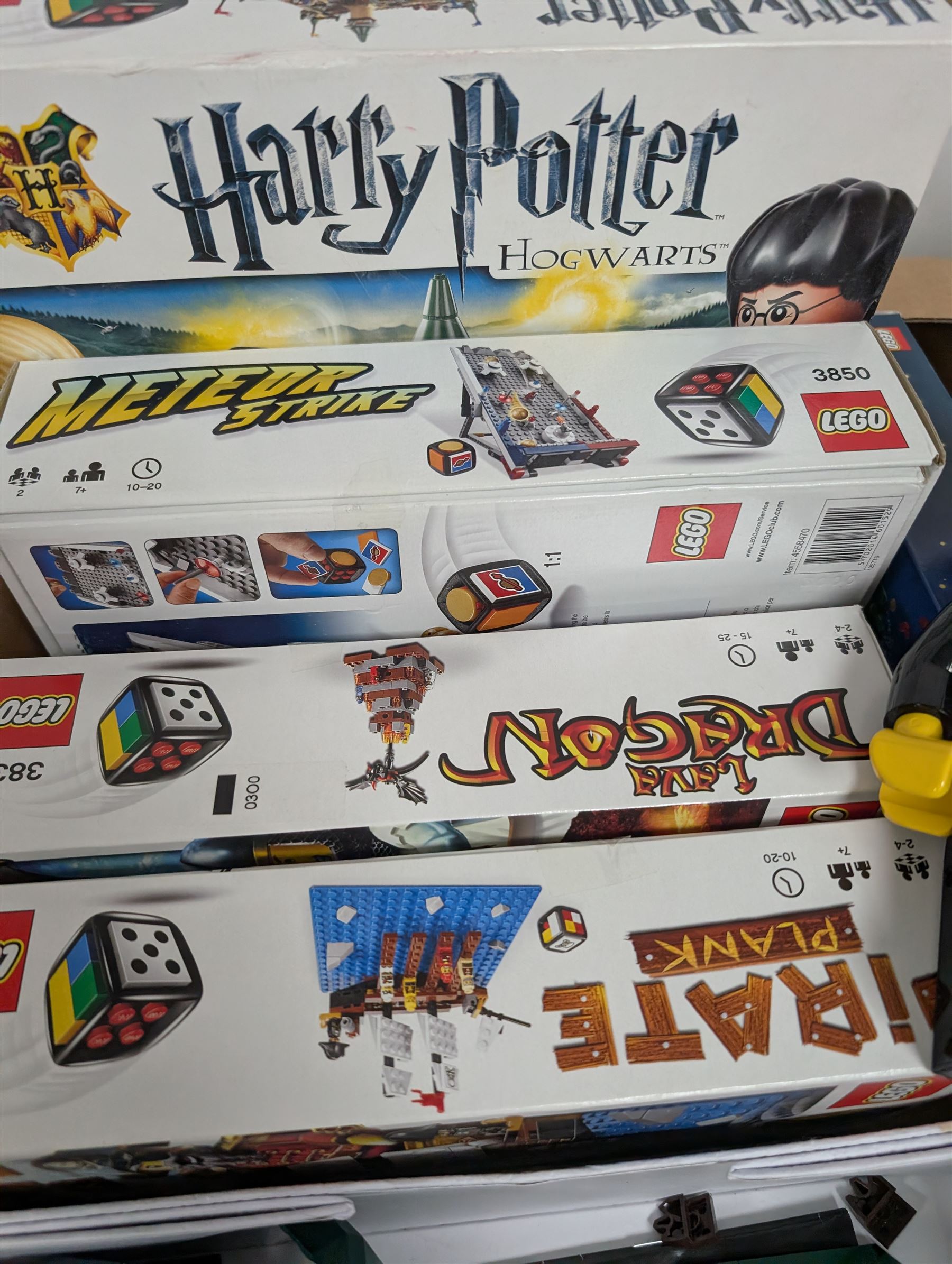 Lego, including partially built Lego Botanicals Orchid, minifigure torch light, five Lego Games including Harry Potter Hogwarts game, Lava Dragon, Pirate Plank, UFO Attack and Meteor Strike 