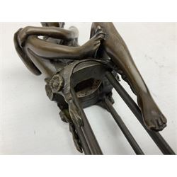 Art Deco style bronze modelled as a female figure, holding her knee, seated upon a chair, after 'Pierre Collinet', H28cm