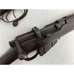 WW1 Lee Enfield SMLE .303 bolt action rifle with 63.5cm barrel and magazine; No.20934; L112cm overall; home deactivated by welding down bolt and end of barrel so requires re-deactivation to modern standards; and 19th century 12-bore double barrel hammer shotgun with 65cm cut-down barrels, non-rebounding hammers and under-lever opening, the lock-plate indistinctly inscribed G.T. Bartrant(?) L75cm overall; home deactivated by welding both barrels closed at breech so requires re-deactivation to modern standards (2) RFD ONLY 