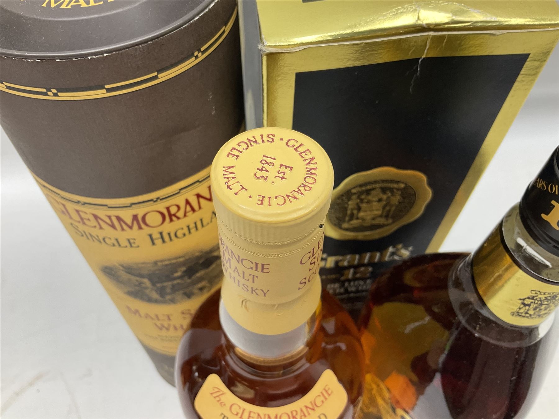 Glenmorangie, ten year old Scotch whisky, 1 litre 43% vol, Grant's twelve year old Scotch whisky 1 litre, 43 G.L and Johnnie Walker Black Label, twelve year old Scotch whisky, 1 litre 43% vol, all boxed (3)