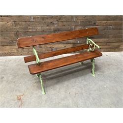 Cast iron and wood slate bench painted in green