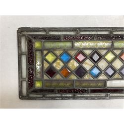 Stained glass and leaded rectangular window panel, with a Dimond pattern to the centre, H56cm, L22cm 