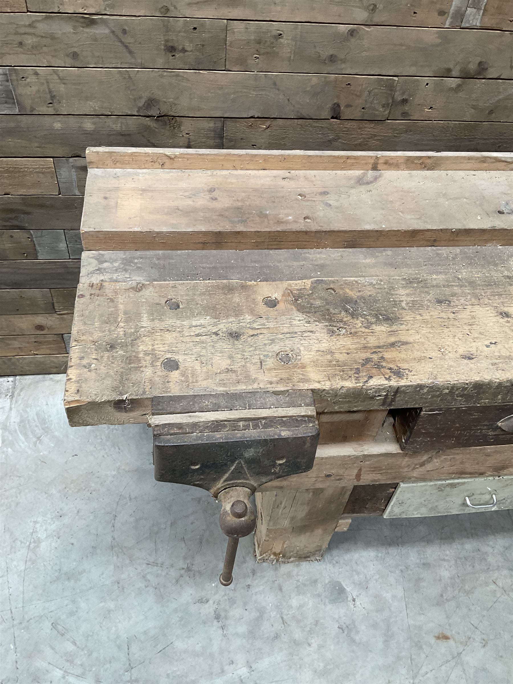 Large vintage work bench, fitted with six drawers and two vice