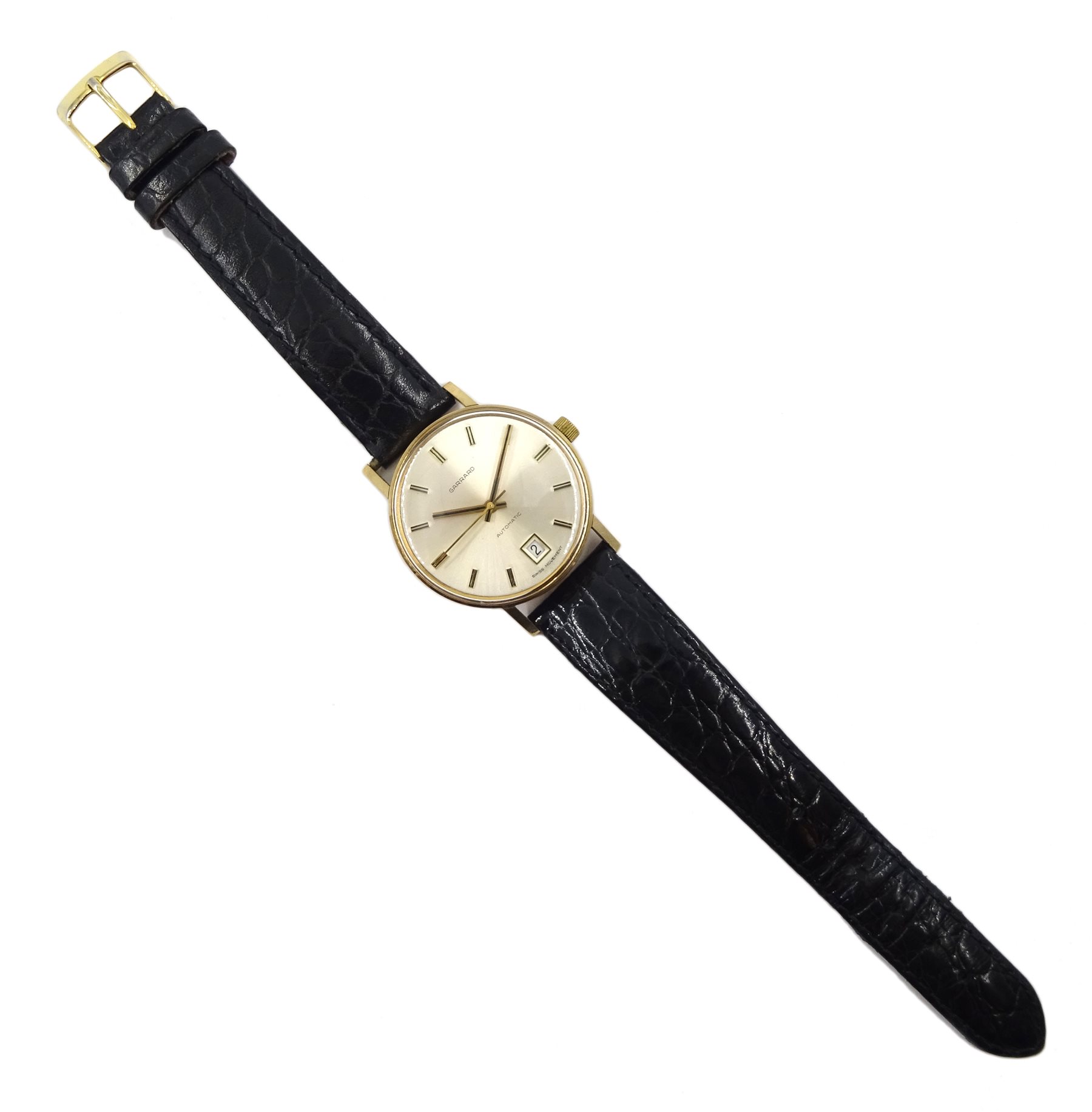 Garrard 9ct gold gentleman's automatic wristwatch, with date aperture, presented by Ford to C Jackson, hallmarked London 1976, on leather strap in original Ford case