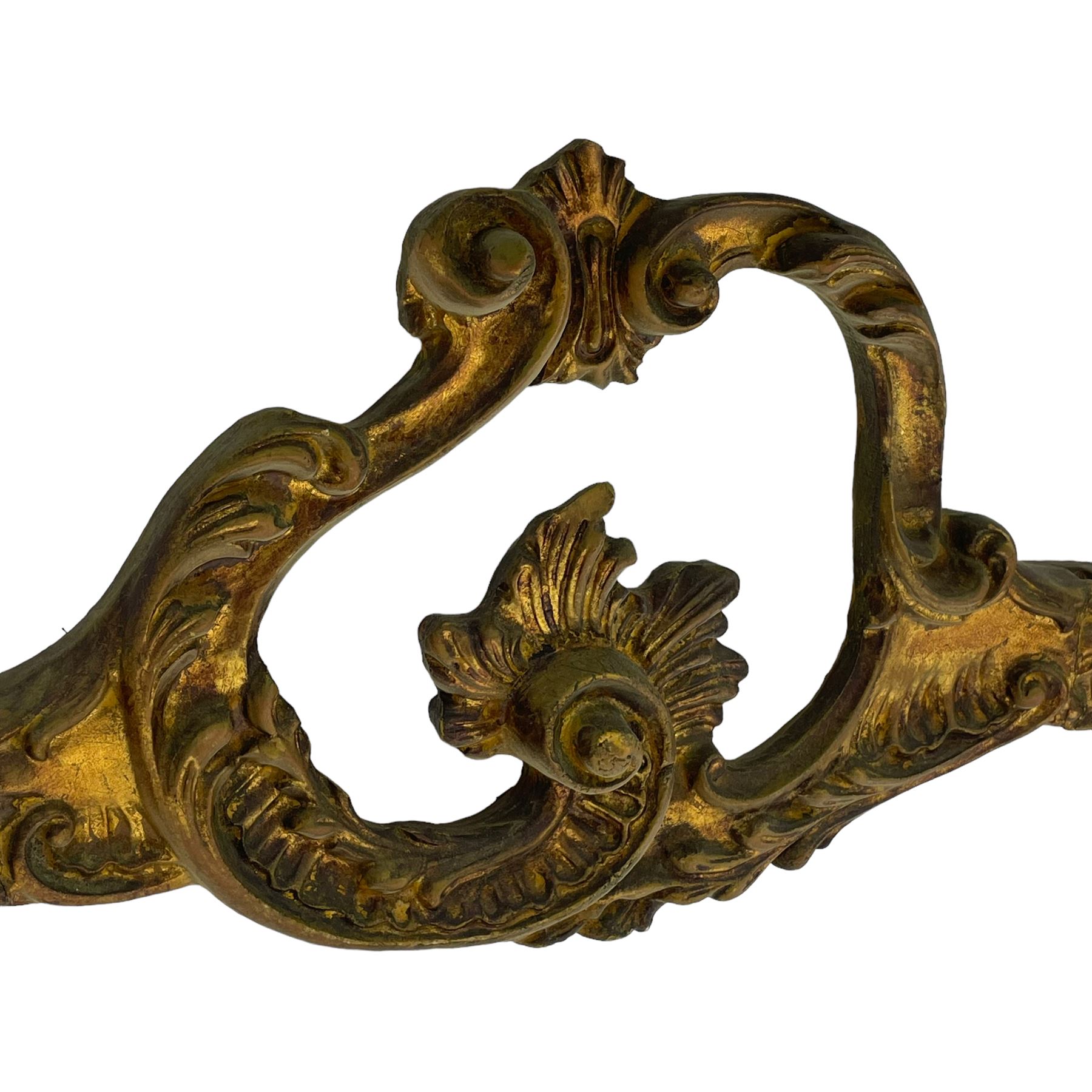 French Rococo design console or pier table, shaped and moulded pale marble top, the apron carved with pierced shell and scrolling acanthus leaves, extending flower head decoration, on four acanthus carved cabriole supports with scrolled terminals, united by shell moulded stretcher rails with central scrolled foliage cartouche 