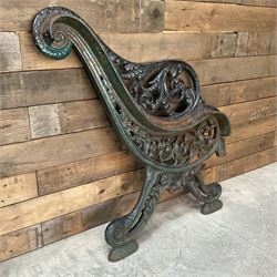Early 20th century heavy cast iron three piece bench ends, decorated with scrolls and floral swags