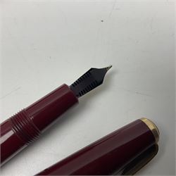 Four fountain pens, each with 14ct gold nibs, comprising Mentmore Paramount, Parker Junior Duofold, Conway Stewart marbleised pen and Waterman's, together with a 14ct gold Conway Stewart 5B nib