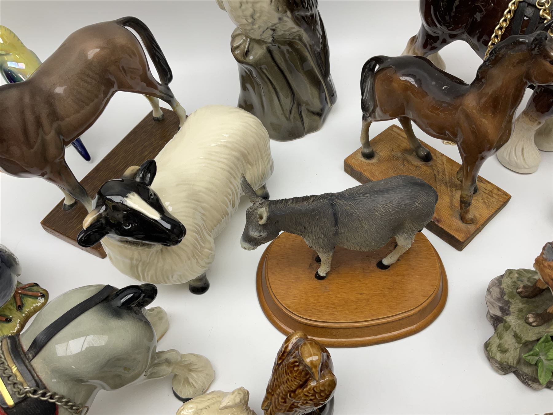 Beswick pigeon no 1383 and a collection of other ceramic animal figures including Campsie Ware lustre budgies, Kowa red fox and Labrador, two shire ponies, two sheep, etc 