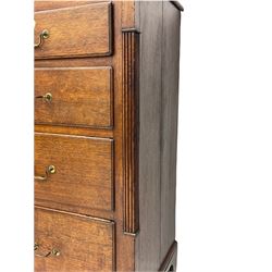 Early 19th century oak chest, fitted with two short and three long drawers, receded columns, bracket feet