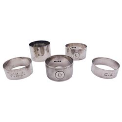 Five silver napkin rings, each of circul