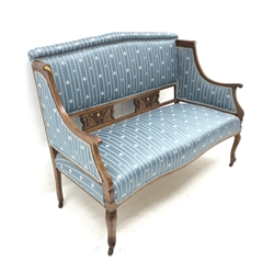 Edwardian inlaid mahogany framed two seat sofa, upholstered in a blue striped fabric, scrolled arms, cabriole legs, W130cm 