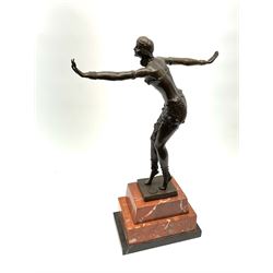 After Demetre Chiparus, an Art Deco style bronze, modelled as a dancer, raised upon a stepped marble base, including base H47.5cm.
