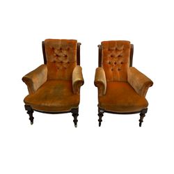 Late Victorian walnut framed Lady's and Gentleman's armchairs, scrolled back and arms, upholstered in buttoned peach velvet fabric with sprung seat, raised on turned supports with brass and ceramic castors