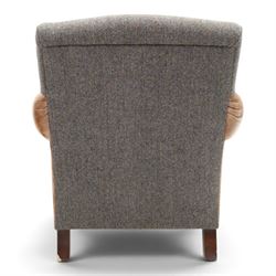 Tetrad - 'Taransay' Harris Tweed and tan leather club armchair, Howard shape with reclined back over deep seat and rolled arms with studwork, raised on turned front supports with castors, the sides and arms upholstered in tan leather with seat and back in herringbone-stitched Harris Tweed
