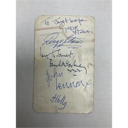 The Beatles - Parlophone Records promotional photographic card depicting a very young group standing together behind a pile of musical instruments; signed verso by George Harrison, Ringo Starr, Paul McCartney and John Lennon, inscribed by two members to 'Janet' and also signed by a female 'roadie' F. Holly who had been assigned to look after her 14.5 x 9cm
Provenance: The signatures were obtained by 'Janet', the vendor, at the Majestic Ballroom, Witham, Hull, at their performance on 13th February 1963, when she was sixteen years old. Janet was still recovering from being injured in a car accident so was removed from the packed audience to watch the performance from the wings where she acquired the signatures, personally watching each member of the band sign the card. Whilst signing the card the Beatles asked her to attend a party later that night at their hotel in Hull but she declined as she was too young and had to return home by 11pm!