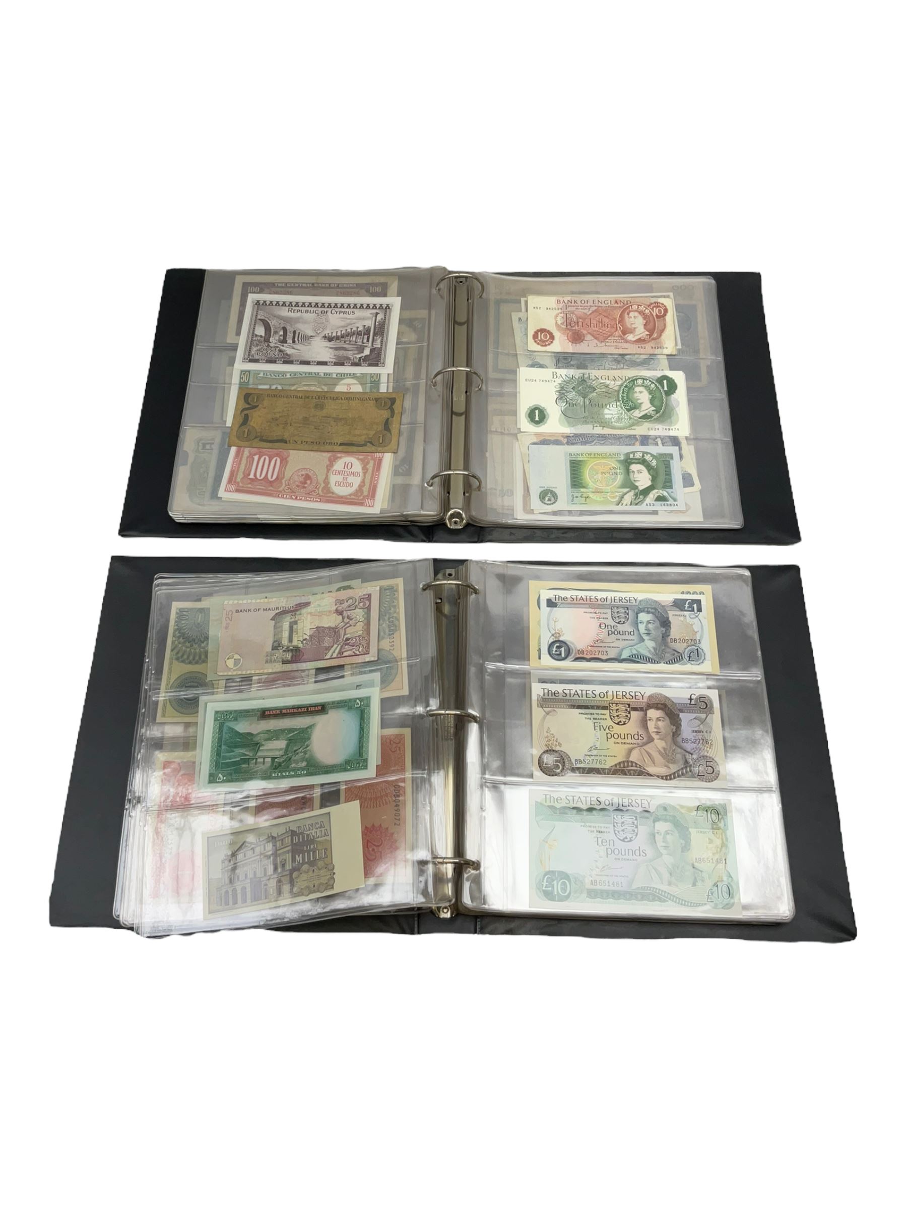 World banknotes, including Queen Elizabeth II The States of Jersey one pound 'DB202703', five pounds 'BB527762' and ten pounds 'AB651481', reserve bank of New Zealand two dollars '1L3 741894', King George V Straits Settlements one dollar 1st January 1935 'F/83 28924', various Bank of England notes etc, housed in two ring binder albums