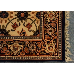  Brick red ground rug with hooked lozenge field, (126cm x 179cm) and hand knotted, Persian pattern wool rug with blue border and foliage filled field, (93cm x 169cm)   