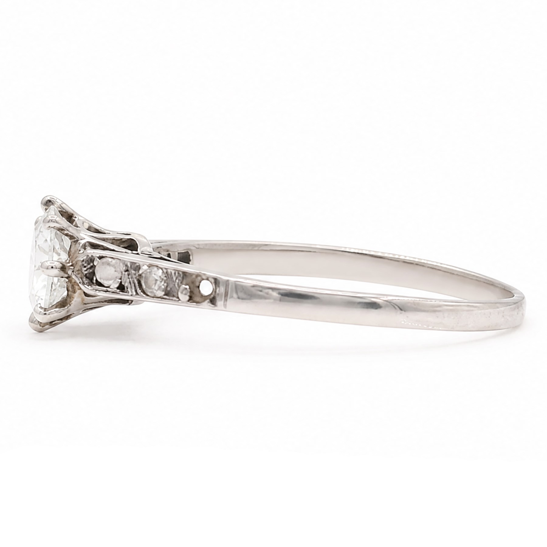 Early 20th century white gold and platinum diamond ring, eight claw set with a single old cut diamond of approx 0.70 carat and rose cut diamond shoulders, stamped PLAT 18ct