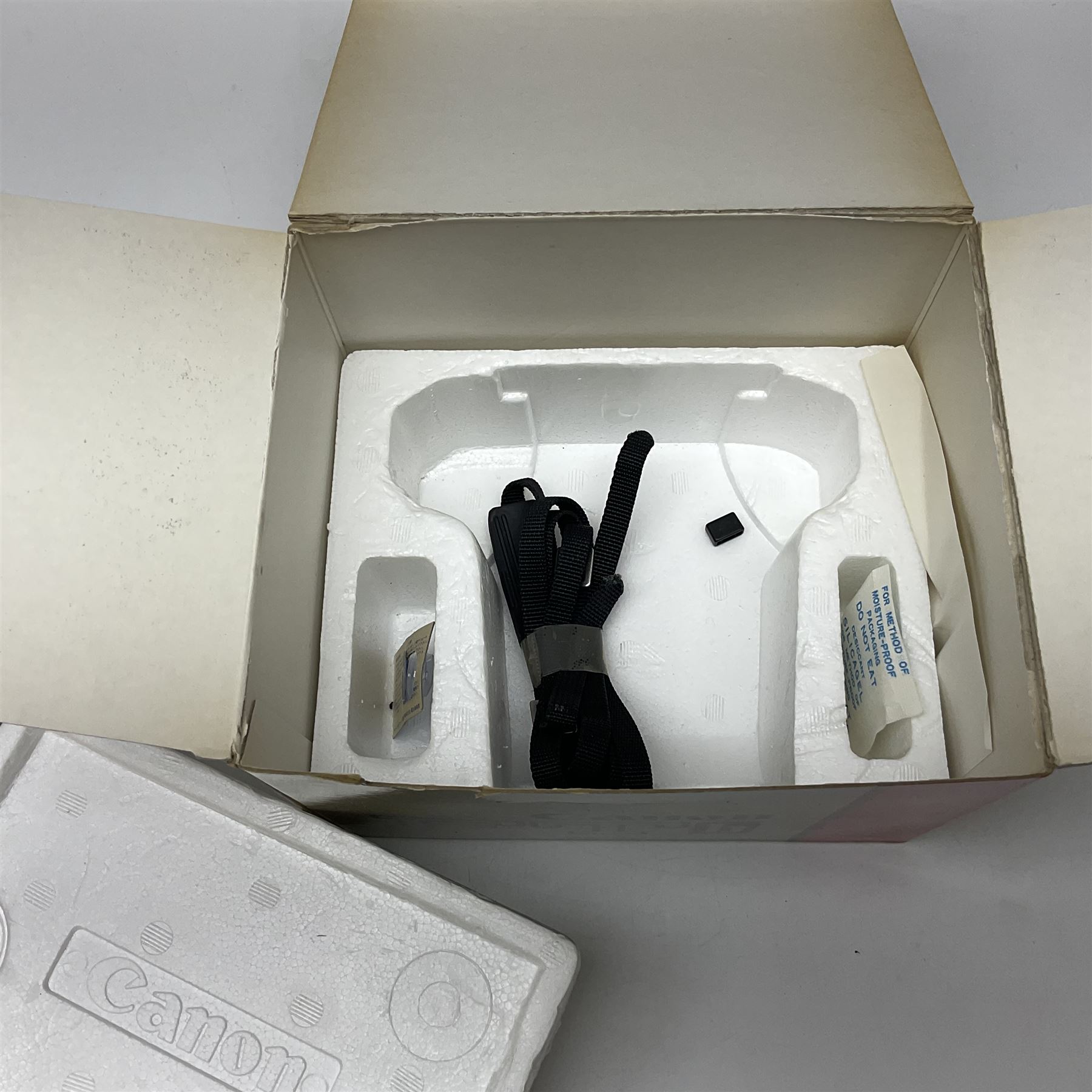 Canon FTb camera body, serial no. 715838, with 'Canon FD 50mm 1:1.8' lens, serial no. 207888, in original box, together with Canon FTb camera body, serial no. 557817, with 'Canon FD 35mm 1:3.5 S.C' lens, serial no. 126210 and Canon EX Auto camera body, serial no. 296244 with 'Canon EX 50mm 1:1.8' lens, serial no. 380869  