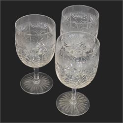 Six cut glass goblets, each with etched and cut floral decoration, together with eight similar bowls, a pair of Waterford Crystal glasses, eight champagne coupes etched with Greek Key border and four etched with floral border