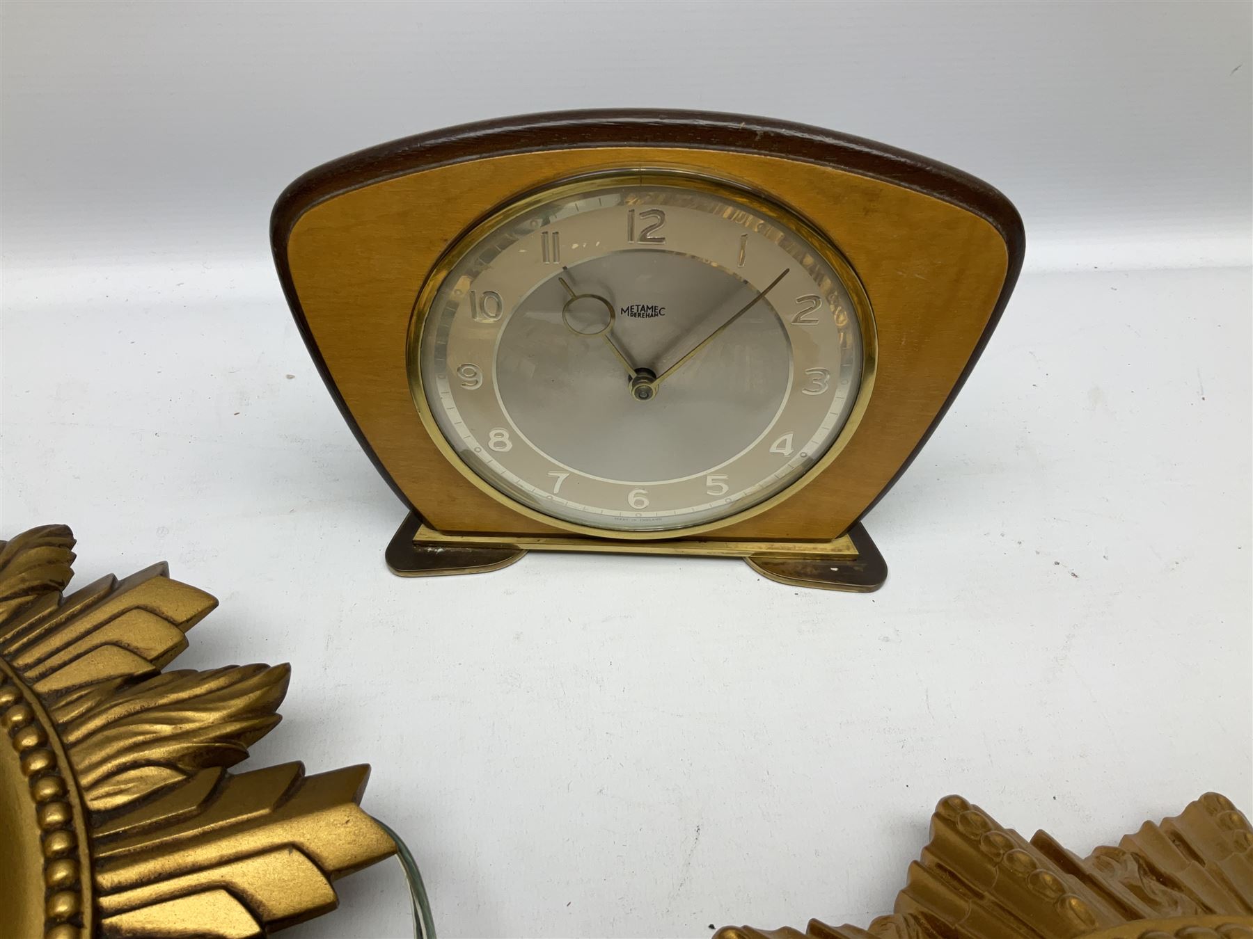 Two Smiths Sectric gilt sunburst wall clocks together Metamec Dereham wooden mantel clock, largest wall clock D35cm